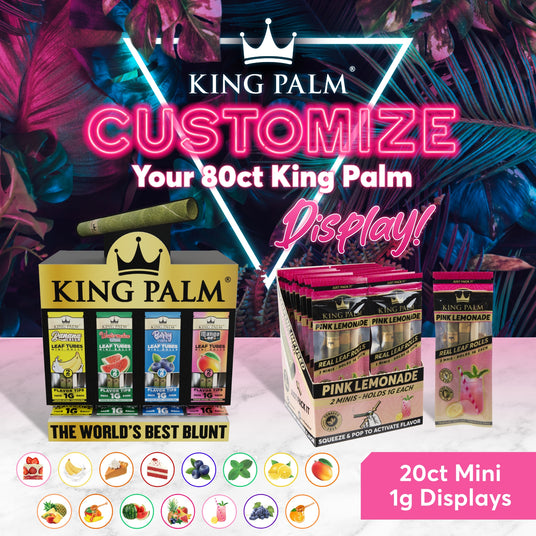 King Palm: Customize your 80ct King Palm Display with 20 ct mini 1g displays. King Palm: The World's Best Blunt. The King Palm mini display as well as a single refill pack of pink lemonade sit on a white marble table with a neon lit jungle pattern behind them.