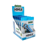 Display of Ooze Hinge vape pens in blue packaging on a white background