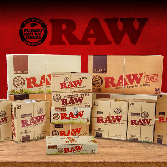 A large group shot of RAW displays on a wood table